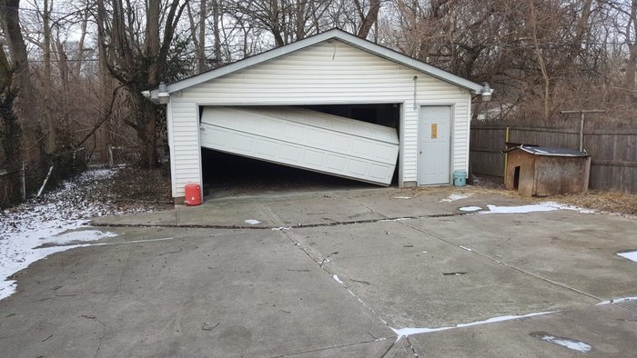 Collapsed garage door — before repair