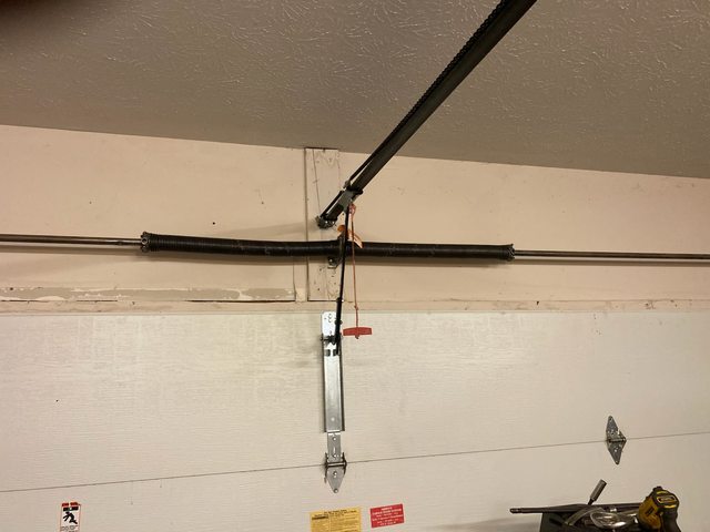 New torsion spring installed — after